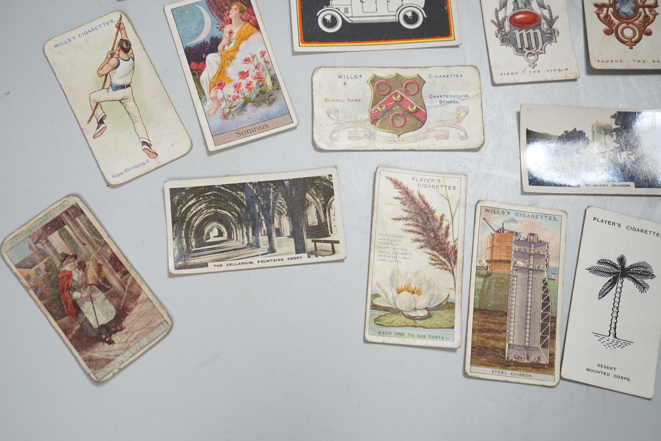 A large collection of mounted and loose cigarette cards